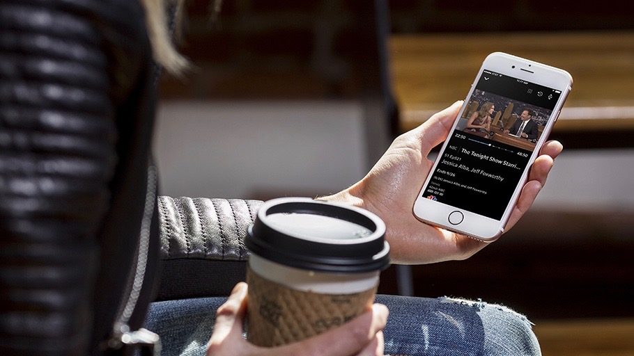 woman holding a phone and coffee