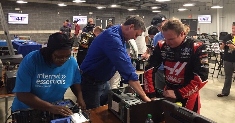 A group of people working on hard drives