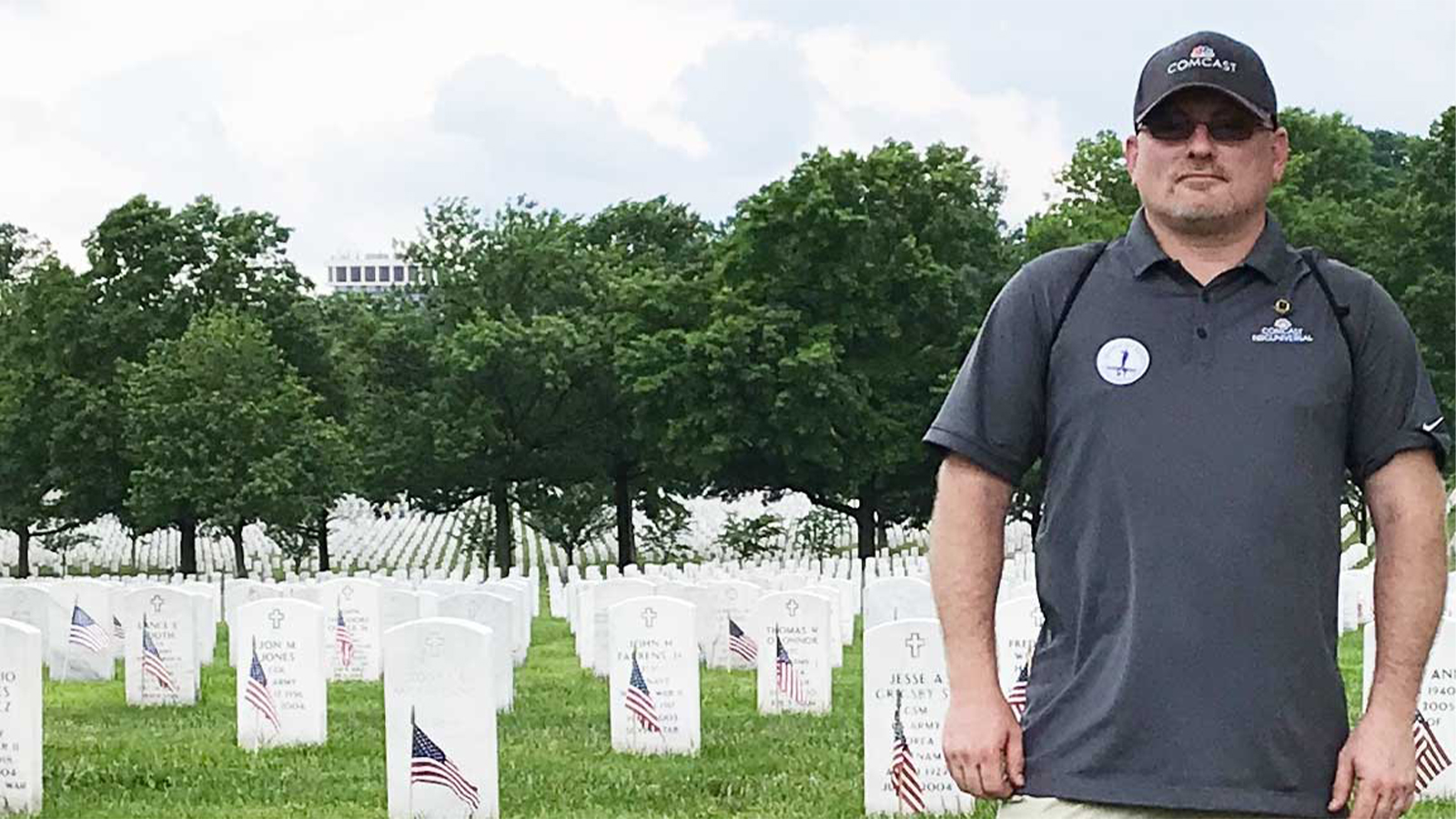 Michael Hackworth stands in a graveyard.