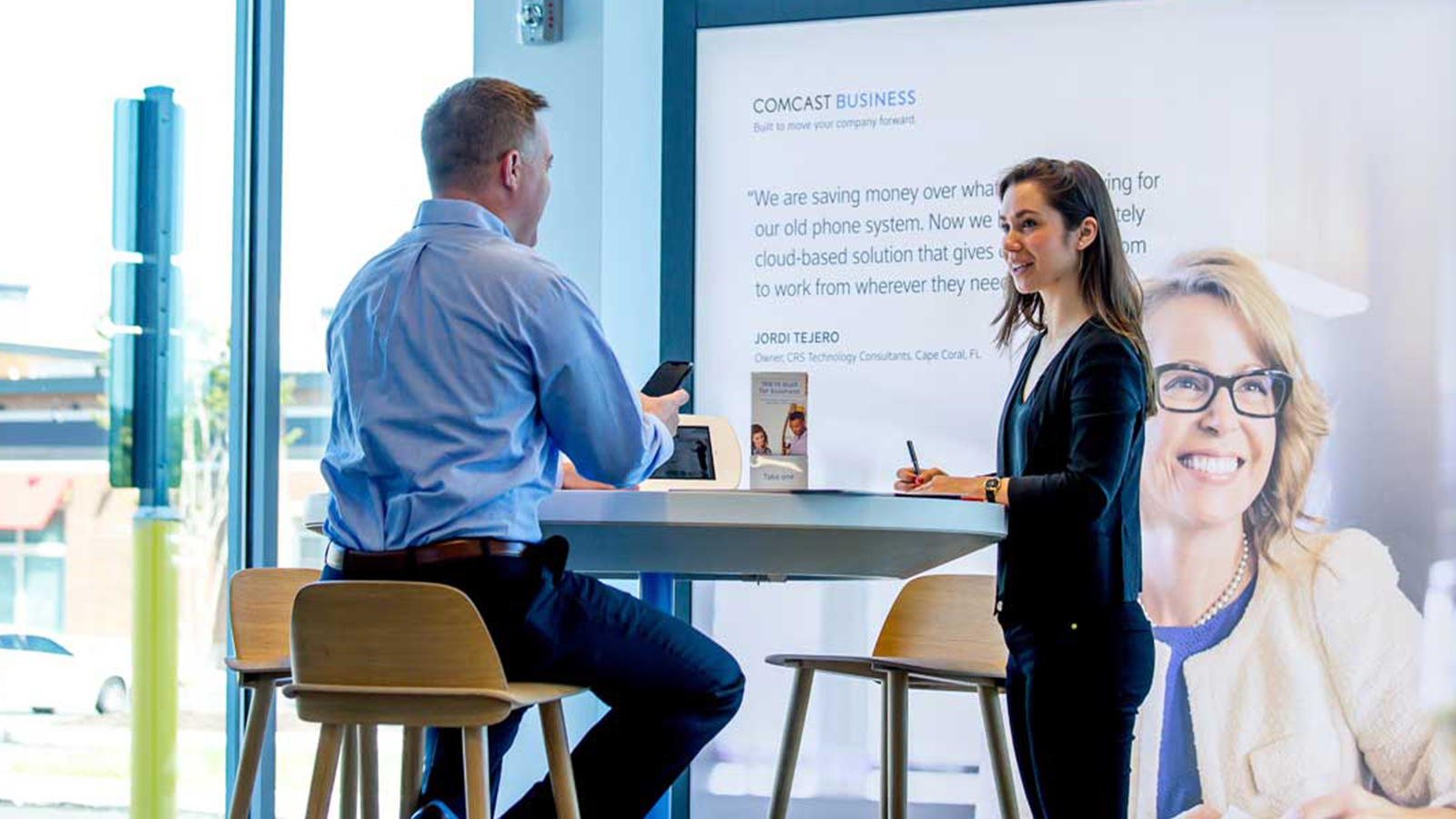 Male and Female having a conversation at an Xfinity Store