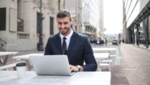 A business owner uses a laptop to do work