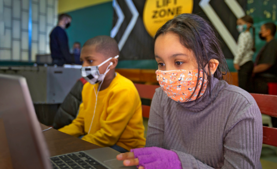 Children using laptops in a Lift Zone