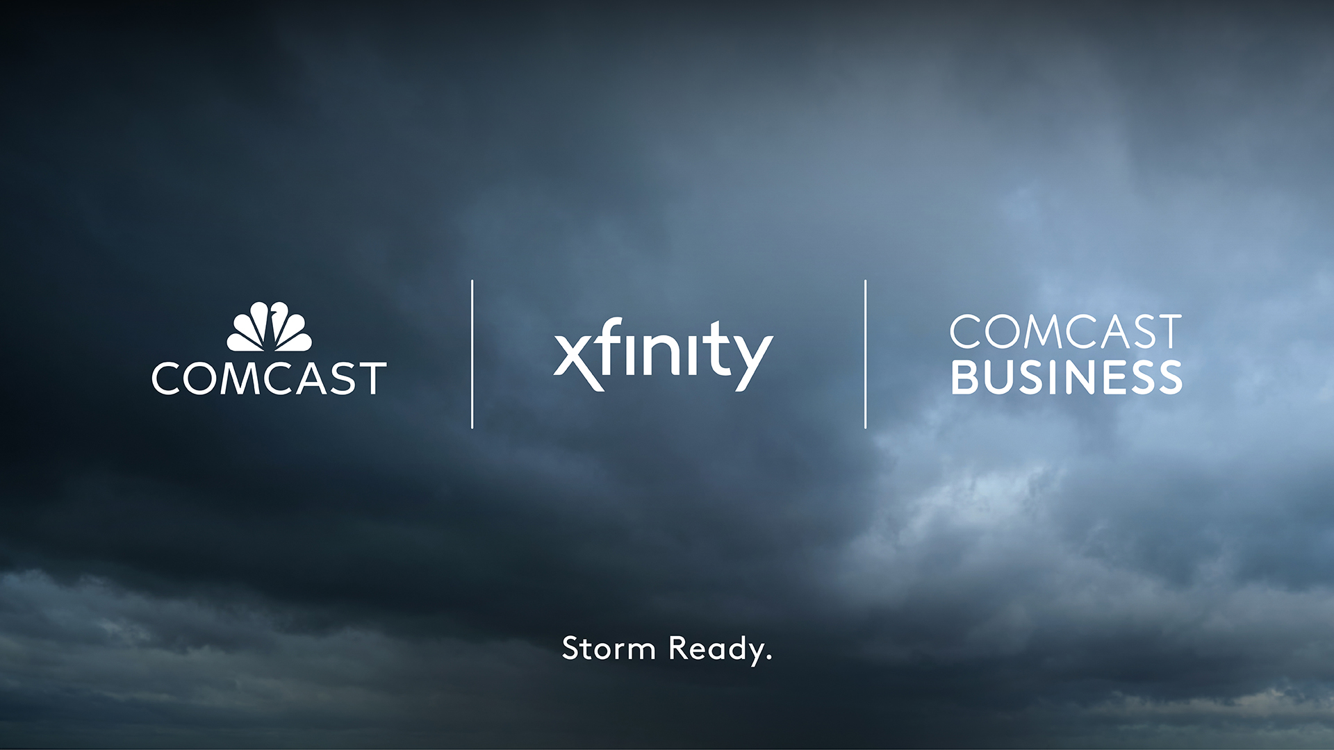 Comcast logo, Xfinity logo and Comcast Business logo in a line with cloudy sky behind them.